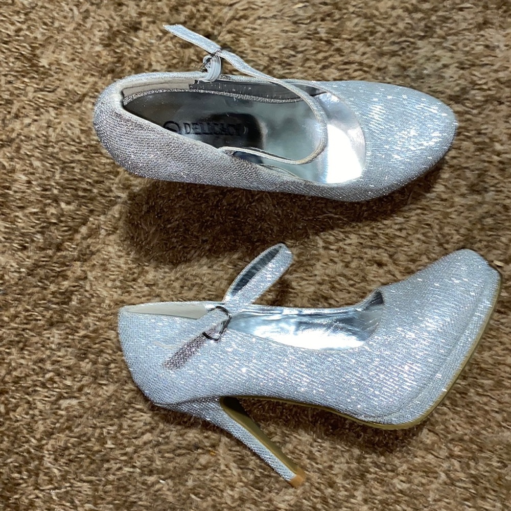 Delicacy silver high heels.